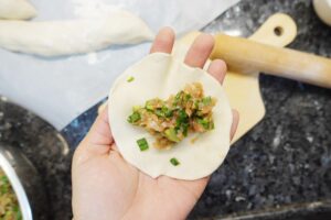 chinese dumpling recipe - wrapping infills into dumpling skin