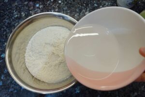Chinese dumpling recipe - Add water to plain flour to make the dumpling skins