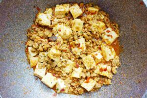 Add tofu and sugar into the pan/wok and let it cook under low heat for 5 minutes.