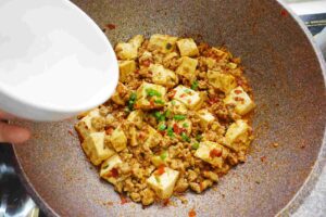 Add thicken starch water into the pan/wok and let the sauce become thicken. Add chili oil (Optional) and you can taste the traditional Si Chuan flavours!