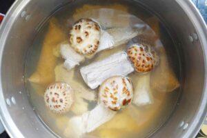 Mushroom, pork ribs inside the pot of bak kut teh